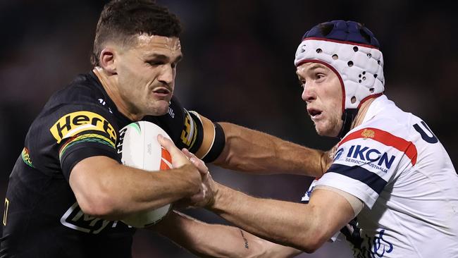 PENRITH, AUSTRALIA - SEPTEMBER 13: Nathan Cleary of the Panthers is tackled by LukeÃÂ Keary of the Roosters during the NRL Qualifying Final match between Penrith Panthers and Sydney Roosters at BlueBet Stadium on September 13, 2024 in Penrith, Australia. (Photo by Cameron Spencer/Getty Images)