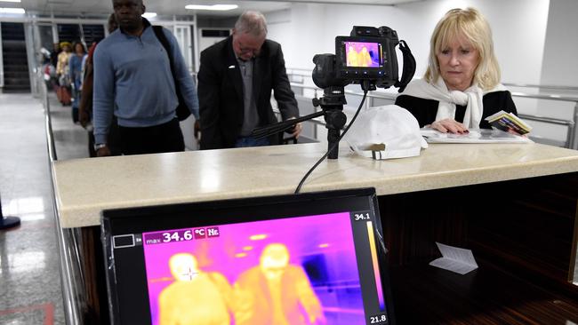 Travellers queue in front of a thermal scanner upon their arrival at the Murtala Mohammed International Airport in Lagos, Nigeria, where there are fears over the outbreak of Coronavirus in China. Picture: Pius Utomi Ekpei / AFP.