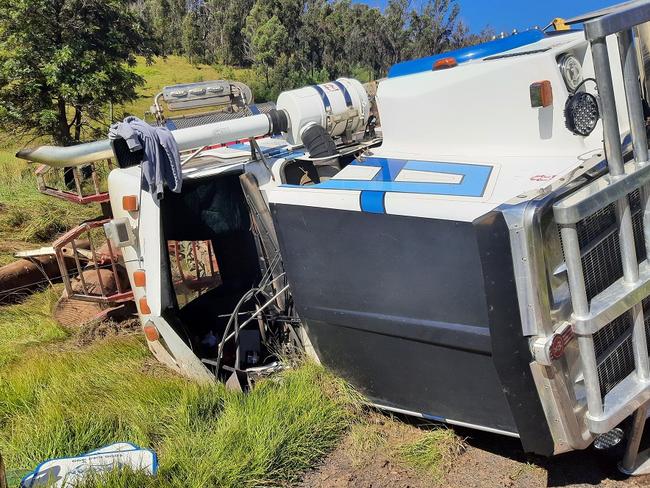 A truck driver had a miraculous escape on Armidale Road west of Grafton when he managed to climb out the cabin of his overturned log truck on April 20, 2022.