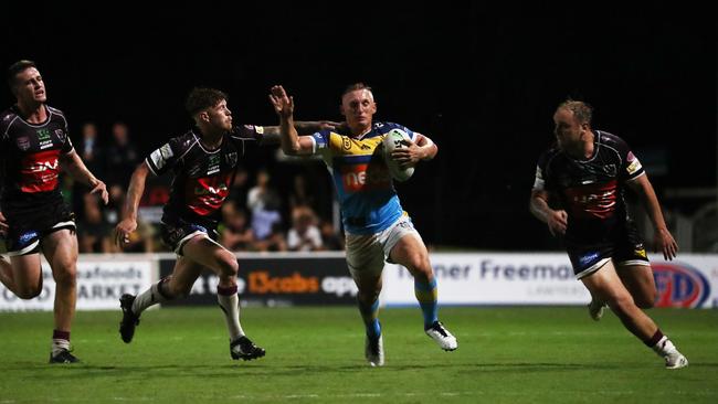 Gold Coast Titans halfback Tanah Boyd shrugs off a Guy Hamilton tackle during a pre-season trial against Burleigh Bears at Pizzey Park. February 20, 2021. Photo Jason O'Brien