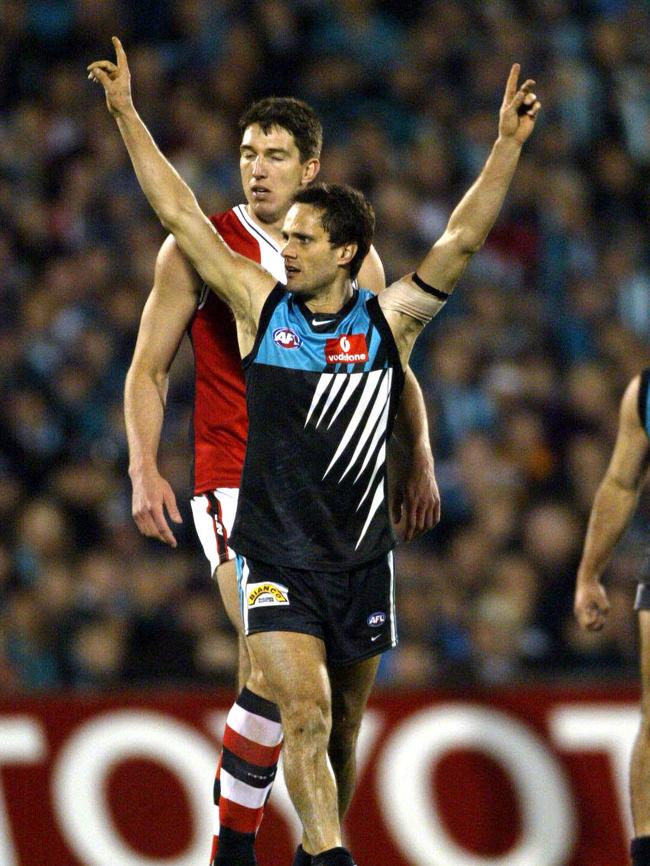 Gavin Wanganeen celebrates after kicking the matchwinning goal in the 2004 preliminary final …