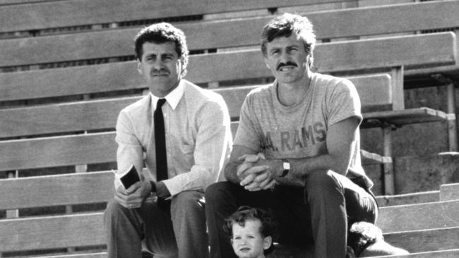 Mick Malthouse (right), then Footscray coach, watches the West Coast Eagles train at VFL Park in preparation for a pre-season clash.