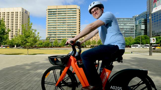 Bryan Ruhle from Neuron Mobility, Australia and New Zealand taking one of the e-bikes for a spin at Victoria Square. Picture: Sam Wundke