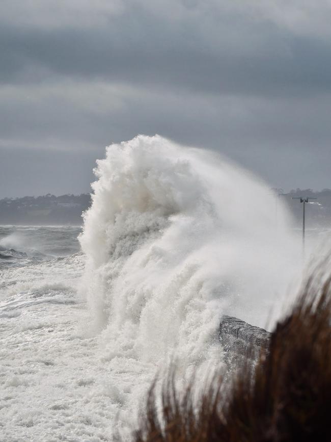 Huge waves smash the Mornington pier as fierce gale winds move across the bay. Picture: Adam Richmond