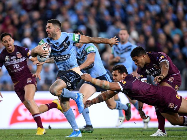 *This picture has been selected as one of the Best of the Year Sports images for 2019*  James Tedesco of the Blues evades a tackle from Josh Papalii of the Maroons during Game 3 of the 2019 State of Origin series between the New South Wales Blues and the Queensland Maroons at ANZ Stadium in Sydney, Wednesday, July 10, 2019. (AAP Image/Dan Himbrechts) NO ARCHIVING, EDITORIAL USE ONLY