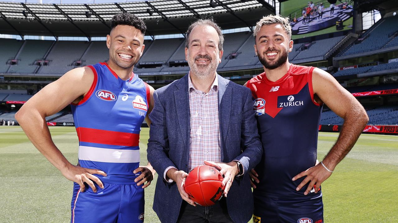 Bulldogs speedster Jason Johansen and Demons defender Christian Salem, pictured Minister for Sport Martin Pakula. Picture: Alex Coppel.