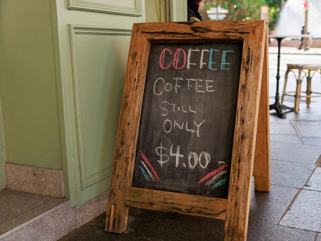 Coffee “still only $4.00” – an inviting sign for cash-strapped Sydneysiders at Cafe de la Fontaine, in Potts Point. Picture: Justin Lloyd