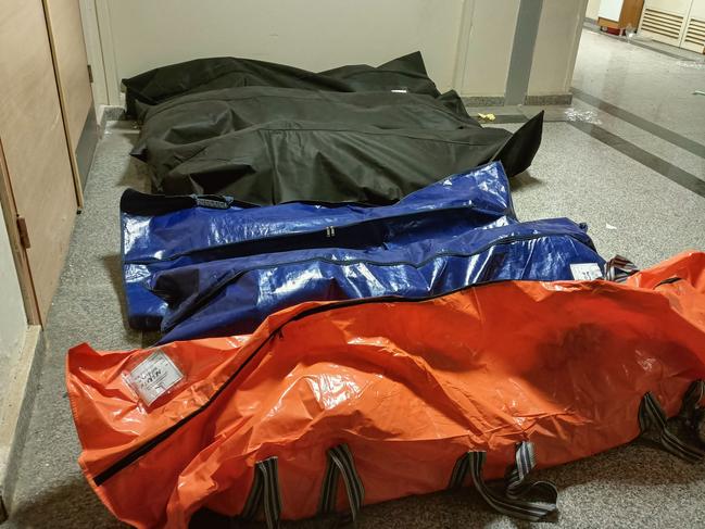 Body bags are pictured on the floor of a corridor in the state hospital of Adiyaman. Picture: AFP