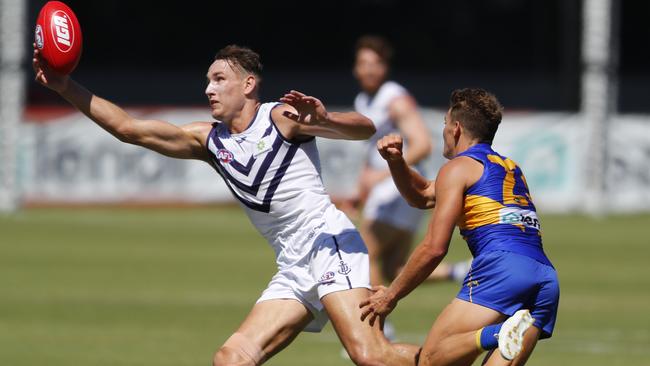 Brennan Cox reels in possession during Fremantle’s trial win.