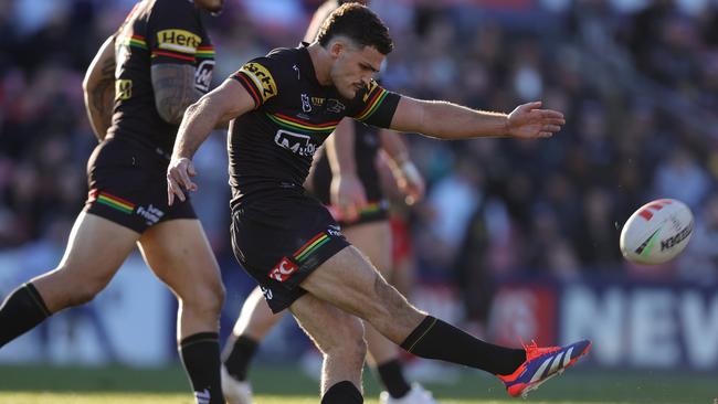 PENRITH, AUSTRALIA - JULY 21: Nathan Cleary of the Panthers kicks the match winning field goal in golden point during the round 20 NRL match between Penrith Panthers and Dolphins at BlueBet Stadium on July 21, 2024 in Penrith, Australia. (Photo by Jason McCawley/Getty Images)