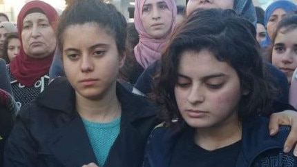 Noor and Roba Maasarwe at a vigil in their sister’s Baka al-Gharbiye community. 