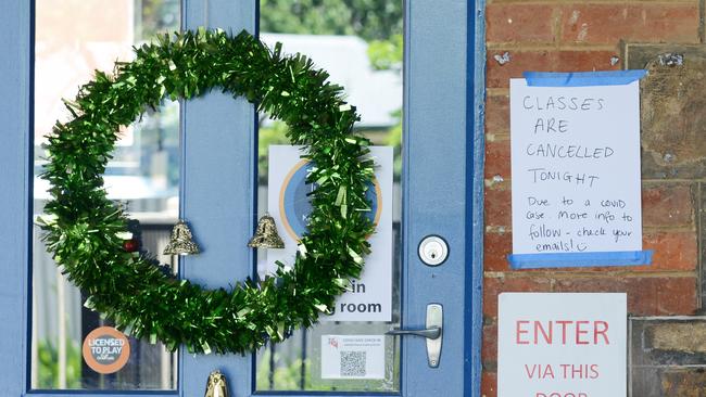 A sign on the Theatre Bugs door alerting people to the Covid clusted. Picture: NCA NewsWire / Brenton Edwards