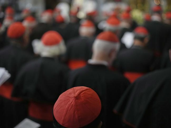 Cardinals led by Cardinal Rolandas Makrikas pray in front of the grave of late Pope Francis inside St. Mary Major Basilica in Rome, Sunday, April 27, 2025. (AP Photo/Andrew Medichini)