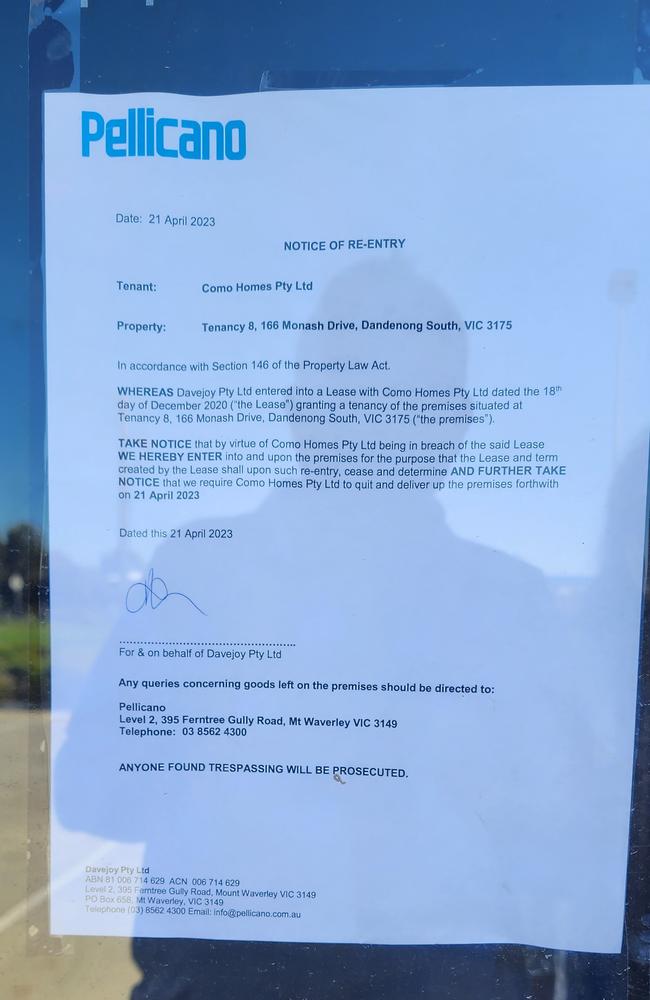 The eviction notice pasted on the office of Como Homes in April.