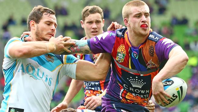 Titan Aidan Sezer grab’s Storm’s Cameron Munster in round 22.