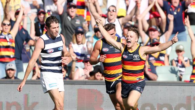 James Rowe kicks one of his two goals against Geelong. Picture: Sarah Reed/AFL Photos via Getty Images