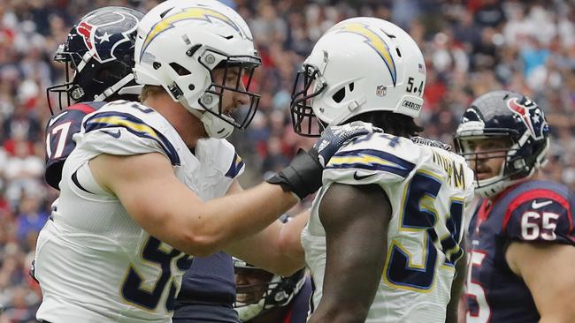 Joey Bosa #99 of the San Diego Chargers celebrates with Melvin Ingram.