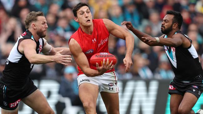 Junior Rioli (right) and Trent McKenzie pressure Sam Weideman.