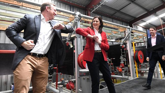 Annastacia Palaszczuk elbow-bumps with her deputy Steven Miles. Miles has credited the Premier with being “the reason Queenslanders are COVID-safe”. Picture: NCA NewsWire / Dan Peled