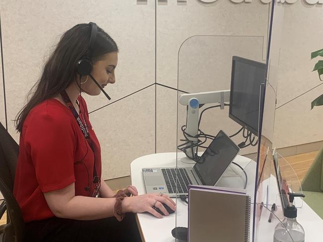 Medibank's Jessica Webb takes customer calls from the health insurer's Geelong store