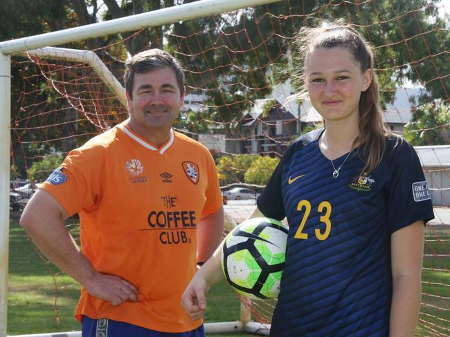 Mossman and Cairns junior footballer Winonah Heatley with former coach Martin Fehlberg from Cairns State High School football centre of excellence program. Picture: Pasco Rogato