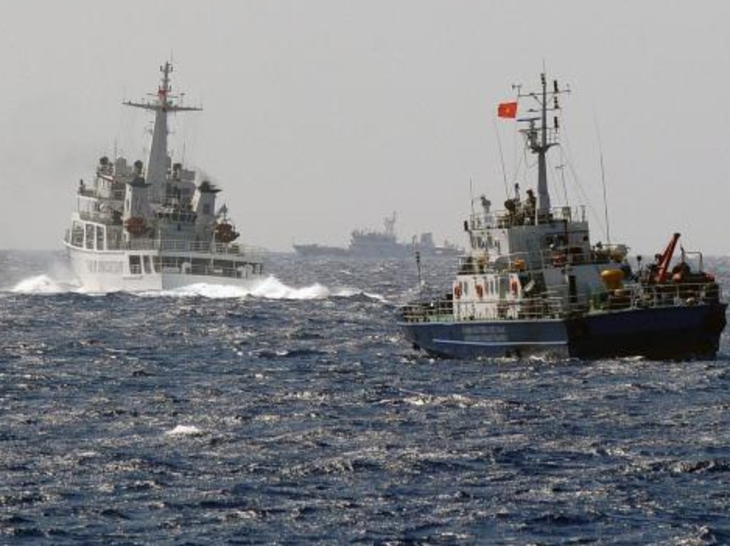 A China Coast Guard ship blocking the way of a Vietnam Coast Guard ship in the South China Sea off Vietnam's central coast. Picture: HOANG DINH NAM/AFP/Getty Images