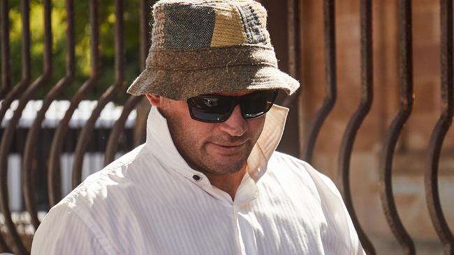 David Anderson walking out of court of the Adelaide Magistrates Court after pleading guilty to assault. Picture: AAP/Matt Loxton