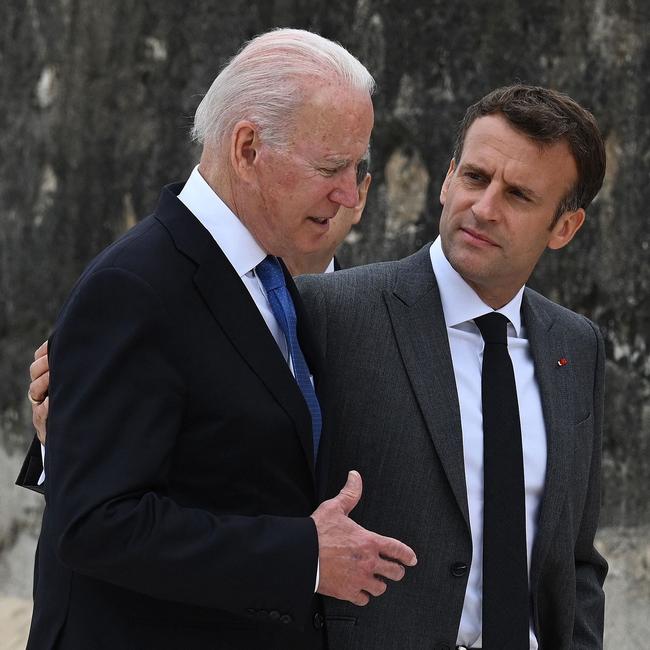 US President Joe Biden guides French President Emmanuel Macron at the G7 summit in Cornwall. Picture: AFP