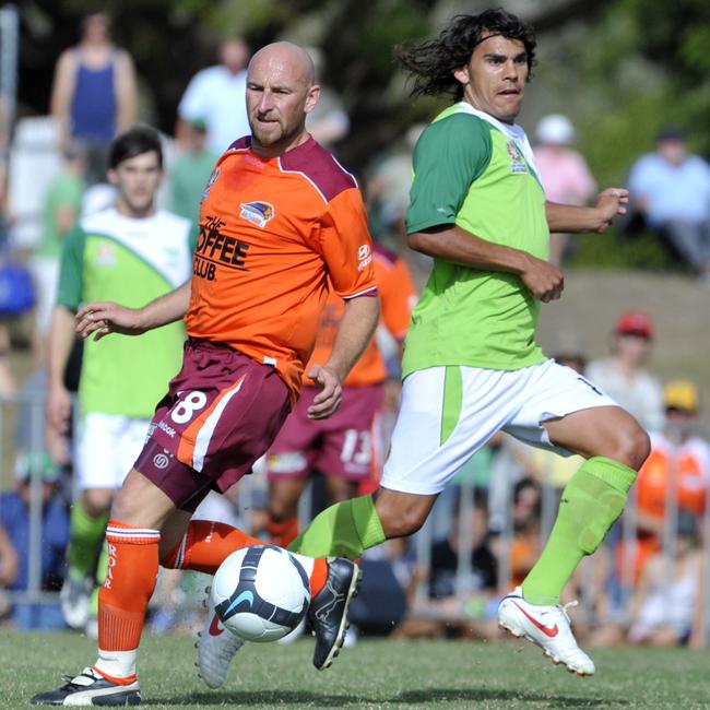 North Queensland Fury against Brisbane Roar at Tony Ireland Stadium, Townsville. Roar's Danny Tiatto and Fury's David Williams.