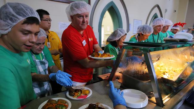 Anthony Albanese serves Christmas lunch at the Exodus Foundation in Sydney. Picture: AAP