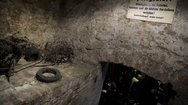 BERLIN, GERMANY - NOVEMBER 07: A sign saying "restricted area" is fixed over the entrance to a restored tunnel once used in an attempt to help people escape from East Berlin into West Berlin on November 7, 2019 in Berlin, Germany. The tunnel, built in 1971 by a team led by Hasso Herschel, led from the basement of a brewery in West Berlin under the Berlin Wall into East Berlin. East German secret police, however, received a tip from an informant and scuttled the plot, arresting at least 12 people who were hoping to flee westward. Between 1961 and 1984 there were approximately 70 tunnels dug, 19 of which led to the successful escape of about 300 people from East Berlin. Germany will celebrate the 30th anniversary of the fall of the Berlin Wall, which led to the collapse of the East German communist government and the eventual reunification of East and West Berlin, on November 9. (Photo by Carsten Koall/Getty Images)