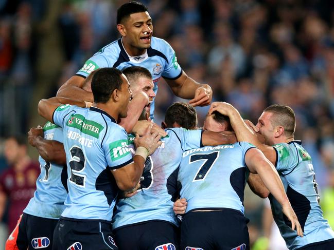 NSW's Trent Hodkinson celebrates scoring a try with team mates during Game 2 of the 2014 State of Origin series at ANZ Stadium .Picture Gregg Porteous