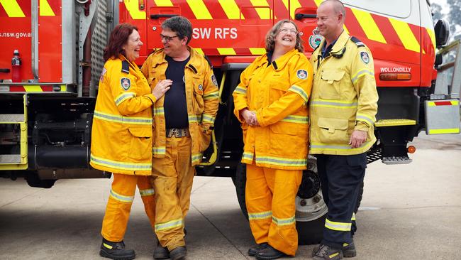 Married couples, and RFS volunteers, Michelle and Dave Metcalf and Jenny and Anthony Peters having a break outside the Wingello Fire Brigade Shed in the Southern Highlands. Picture: Tim Hunter