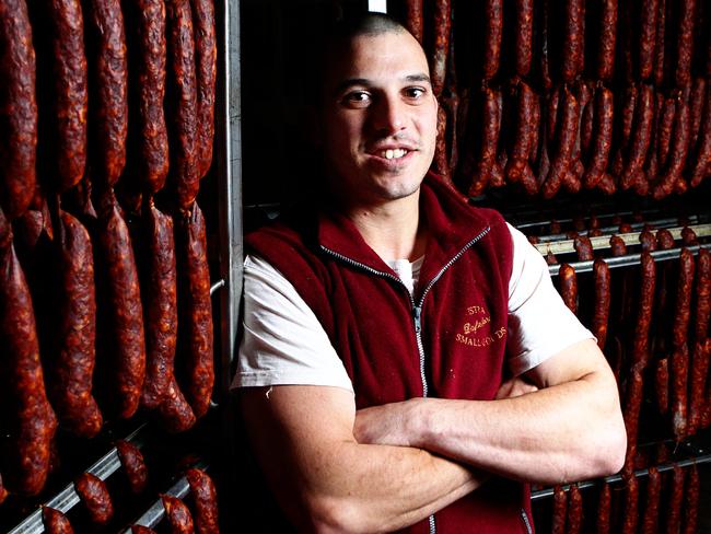 Bernie Jurcan inspects the latest batch of preserved meats from his family’s business, Istra Smallgoods near Daylesford. Picture News Corp Australia