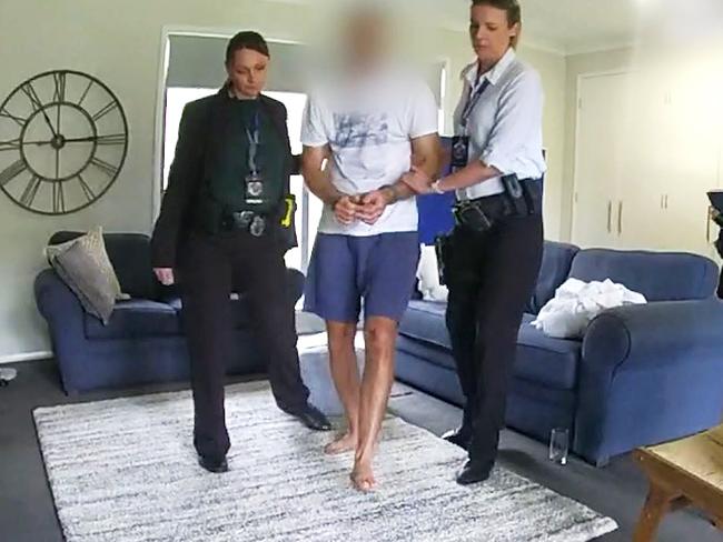 QLD Police vision of Robert Crawford arrested at his home.