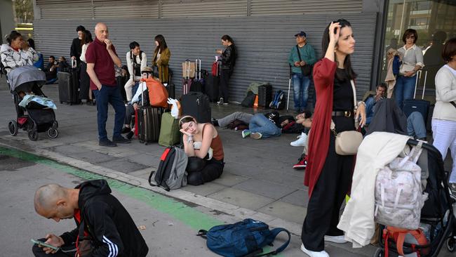 People outside Barcelona Sant railway station during a massive power cut. Picture: AFP