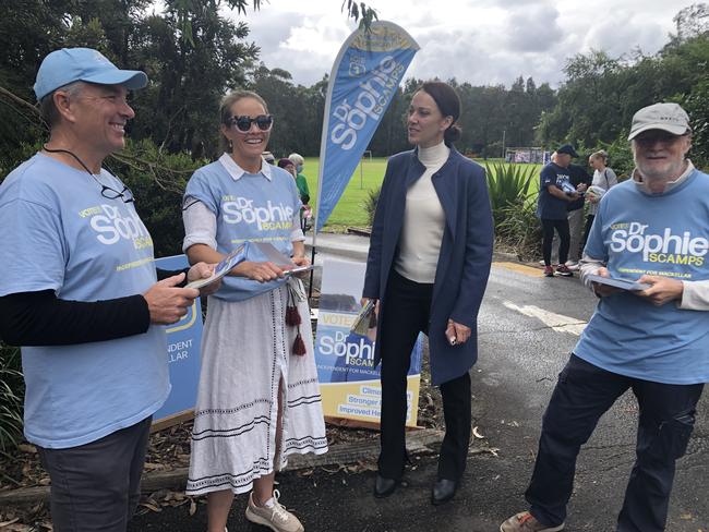 Independent candidate for Mackellar, Sophie Scamps (second from right) with her campaign manager Jacqui Scruby and campaign volunteers Ken Christensen and Clayton McLellan at the Nelson Heather Community Centre pre-poll station at Warriewood on Tuesday. The Climate 200 group is providing $700,000 towards her campaign. Picture: Jim O'Rourke