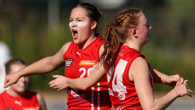 MELBOURNE, AUSTRALIA – MAY 11: Power players Ava Deszcz and Baia Pugh celebrate a goal during the 2025 Coates Talent League Girls Round 05 match between Geelong Falcons and Gippsland Power at Melbourne Avalon Airport Oval on May 11, 2025 in Melbourne, Australia. (Photo by Craig Dooley/AFL Photos)