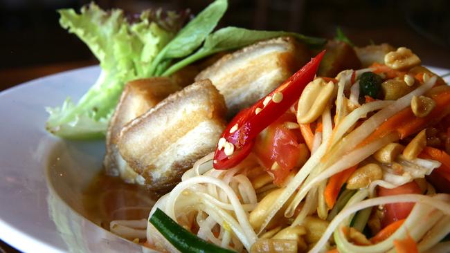 Papaya salad with crispy pork belly is from the street food menu.