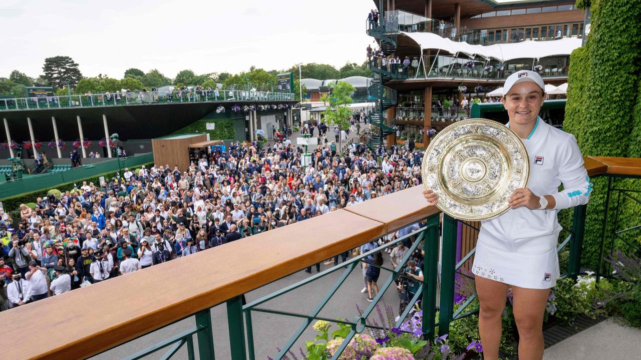 Ash Barty poses with the winner’s Venus Rosewater Dish trophy.