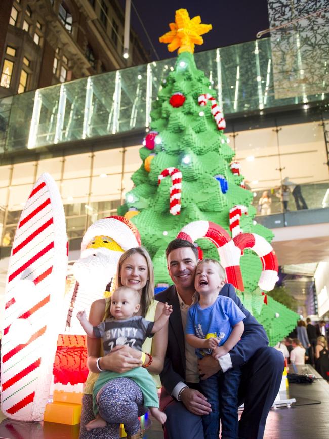 Troy with his family at the tree installation in Martin Place.