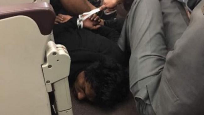 The suspect was tackled and tied up by passengers and crew after he allegedly tried to storm the cockpit. Picture: Supplied