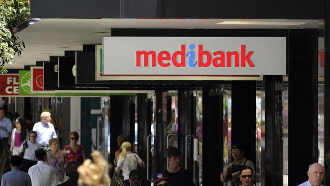 Medibank branch, Adelaide Street, Brisbane. Medibank was floated on the stock market today. Customers discuss their impressions of the float. Photo: Claudia Baxter