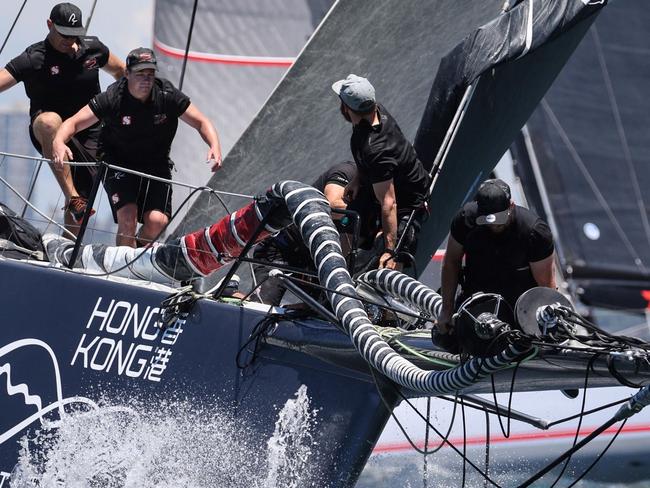 Crew aboard the boat "Scallywag" compete in the 2021 Big Boat Challenge, which brings together some of the biggest boats in the annual Sydney to Hobart fleet, on Sydney Harbour on December 7, 2021. (Photo by DAVID GRAY / AFP) / -- IMAGE RESTRICTED TO EDITORIAL USE - STRICTLY NO COMMERCIAL USE --