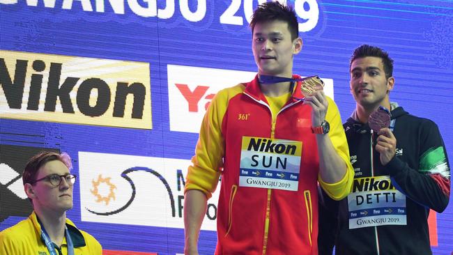 Silver medallist Australia's Mack Horton (L) refuses to stand on the podium with gold medallist China's Sun Yang (C) and bronze medallist Italy's Gabriele Detti after the final of the men's 400m freestyle event.