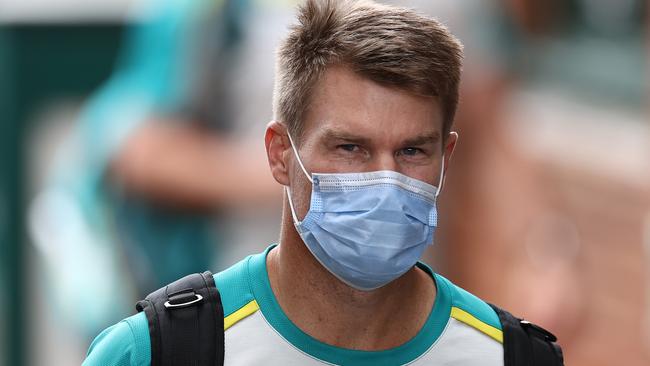 Opener David Warner wears a mask before a nets session at the SCG.