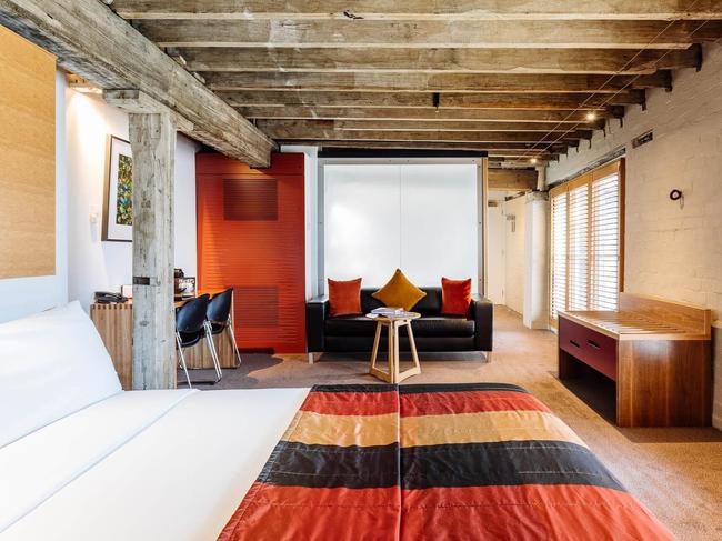 Original exposed beams add a touch of history to a modern room. Picture: Henry Jones Art Hotel.