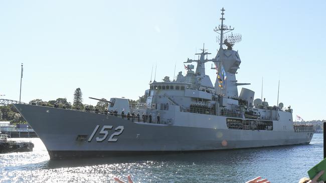 Family and friends greet HMAS Warramunga and her crew as she arrives at Garden Island in Syndey, Sunday, July 8, 2018. HMAS Warramunga returned to Sydney after being deployed in the Middle East for nearly nine months, where it interdicted about $2.17b worth of illegal drugs from 16 smuggling vessels. (AAP Image/Paul Braven) NO ARCHIVING