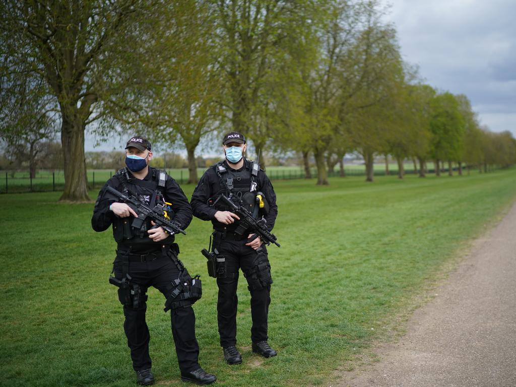 Armed police patrol the Long Walk ahead of the Duke of Edinburgh’s funeral, with just 30 mourners attending. Picture: Christopher Furlong/Getty Images