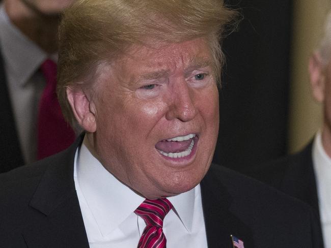 Sen. John Barrasso, R-Wyo., left, and Sen. John Thune, R-S.D., stand with President Donald Trump, and Vice President Mike Pence, as Trump speaks while departing after a Senate Republican Policy luncheon, on Capitol Hill in Washington, Wednesday, Jan. 9, 2019. (AP Photo/Alex Brandon)